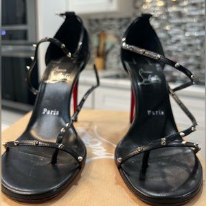 CHRISTIAN LOUBOUTIN
Black & Red Riojana Spikes 100mm Heeled Sandals